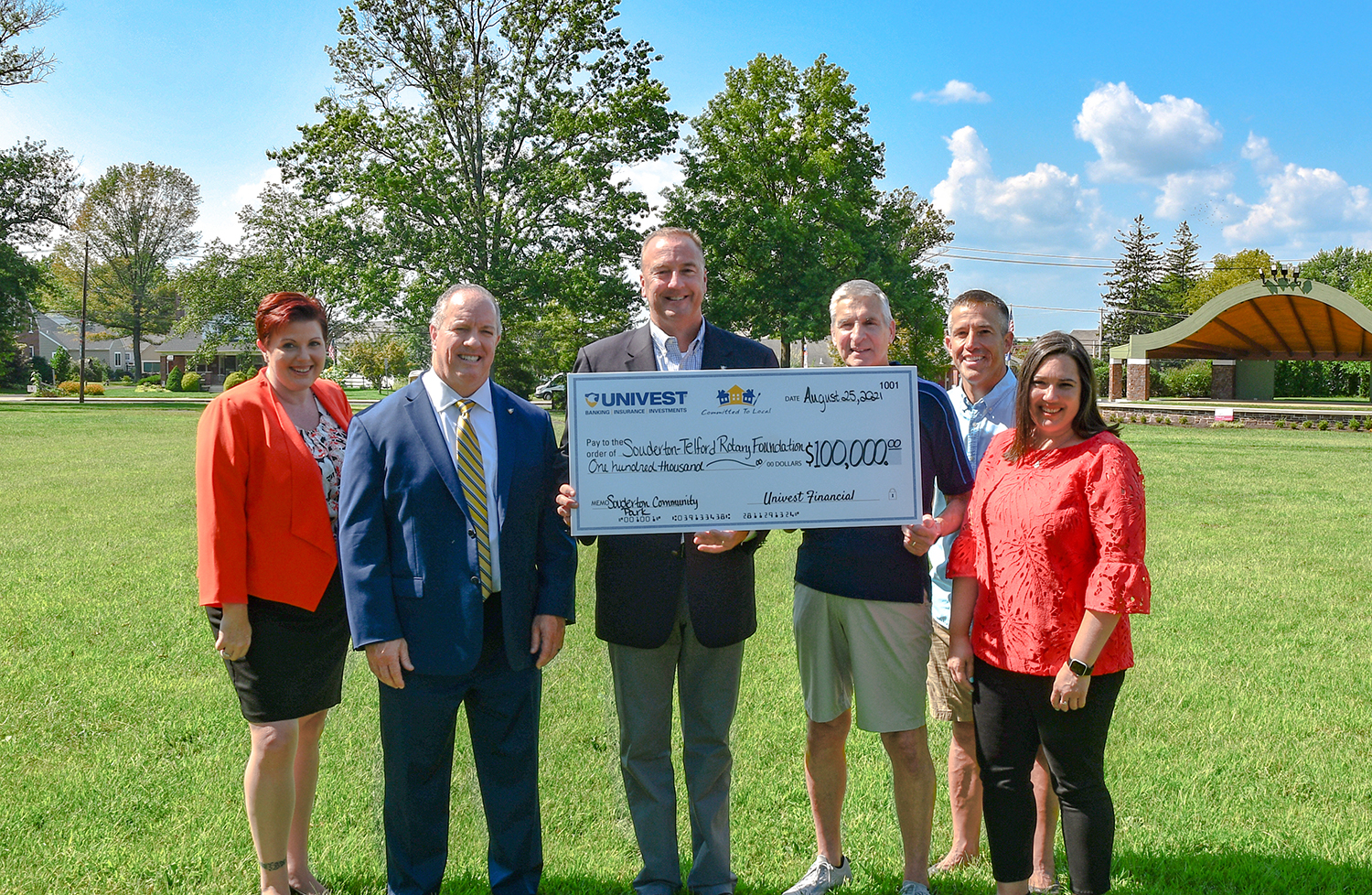 Univest members holding sponsorship check in Souderton Park.